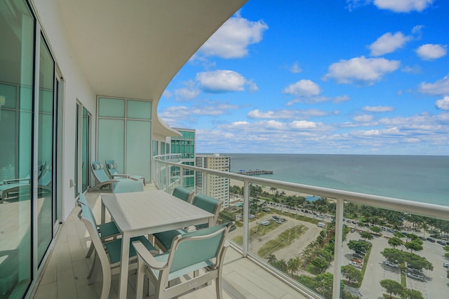 balcony featuring a water view