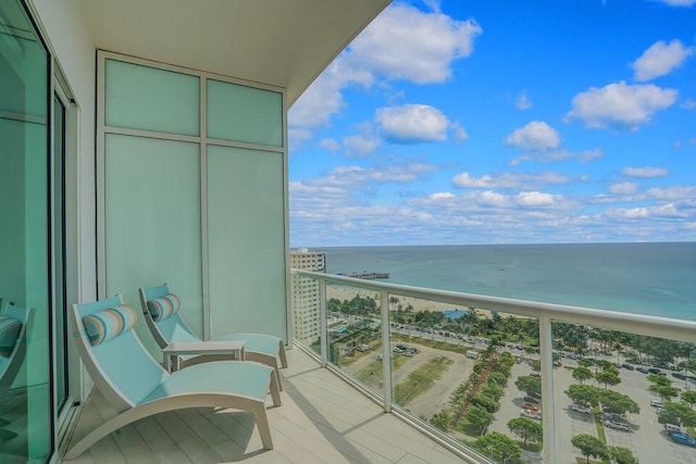 balcony featuring a water view