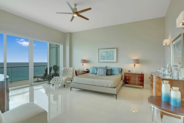 tiled bedroom with access to outside, a water view, and ceiling fan