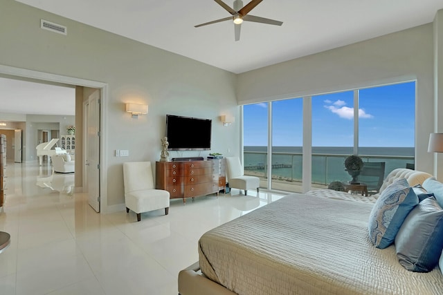 bedroom with ceiling fan and light tile patterned flooring