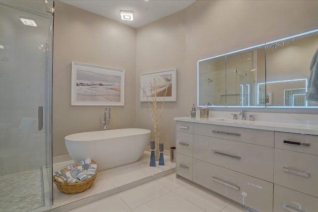 bathroom featuring tile patterned flooring, vanity, and separate shower and tub