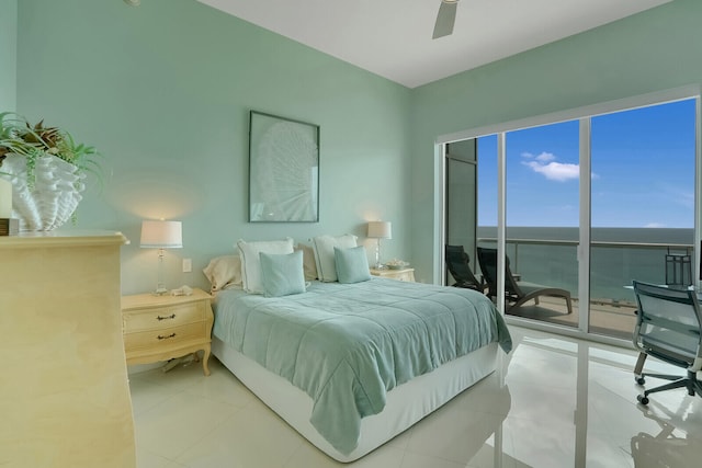 tiled bedroom featuring access to exterior, ceiling fan, and a water view