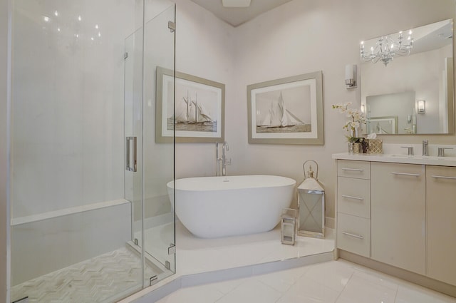 bathroom featuring tile patterned floors, vanity, and shower with separate bathtub