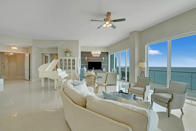 tiled living room with ceiling fan with notable chandelier