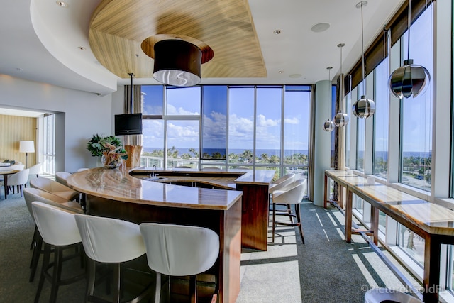 kitchen with plenty of natural light and decorative light fixtures