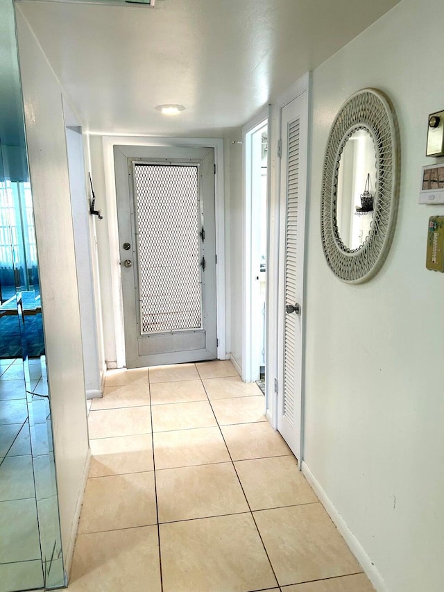 corridor with light tile patterned floors