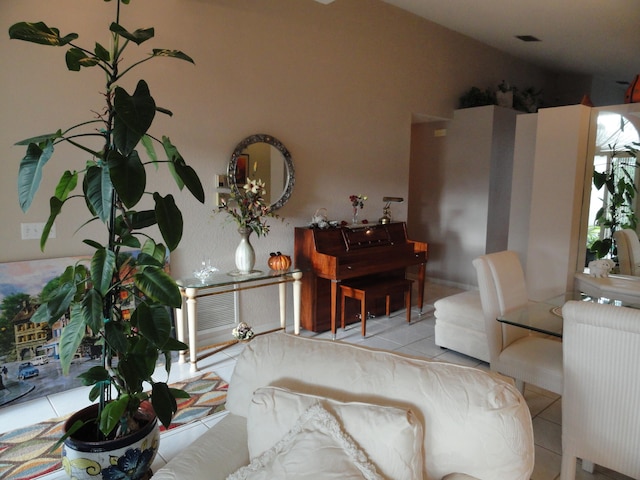 living room with light tile patterned flooring and radiator heating unit