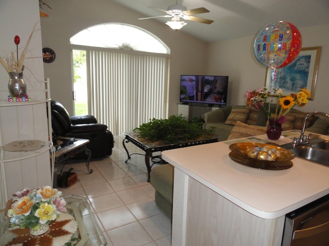 tiled living room with sink and ceiling fan