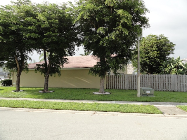 view of side of home featuring a yard