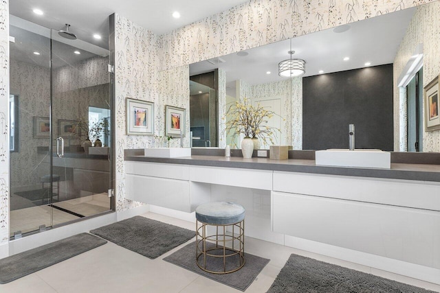 bathroom with vanity, a shower with shower door, and tile patterned flooring