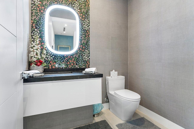 bathroom with vanity, toilet, and tile patterned floors