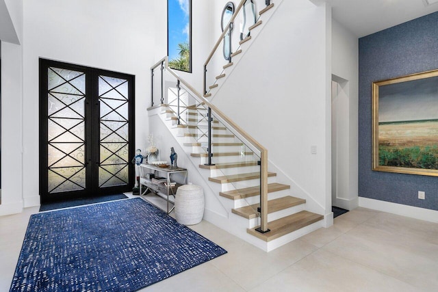 foyer featuring french doors and tile patterned floors