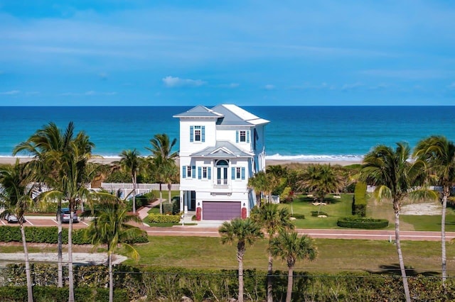 aerial view featuring a view of the beach and a water view