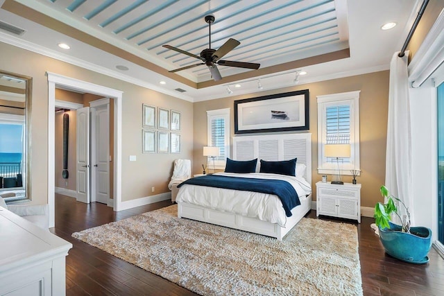 bedroom with multiple windows, crown molding, ceiling fan, and dark wood-type flooring