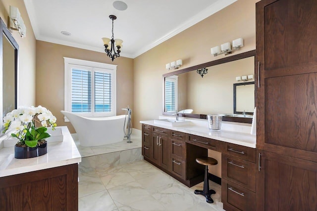 bathroom with a notable chandelier, vanity, crown molding, and a washtub