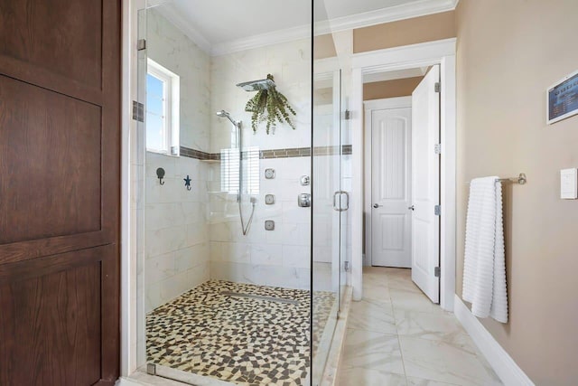 bathroom featuring a shower with door and ornamental molding