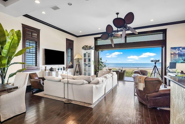 living room with ceiling fan, a healthy amount of sunlight, dark hardwood / wood-style floors, and ornamental molding