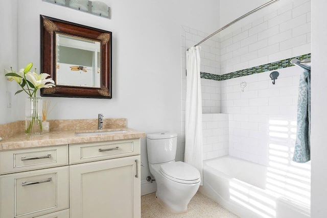 full bathroom featuring shower / bath combo, vanity, and toilet