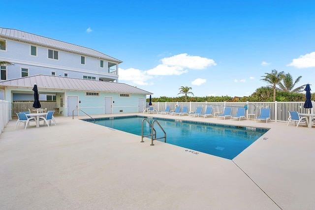 view of swimming pool with a patio