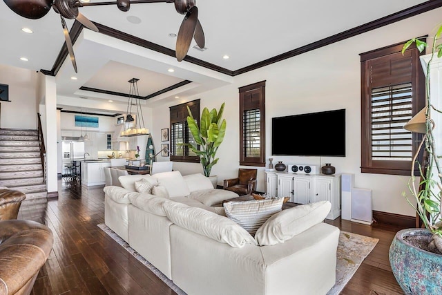 living room with ceiling fan, dark hardwood / wood-style floors, and ornamental molding