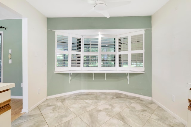 empty room featuring ceiling fan