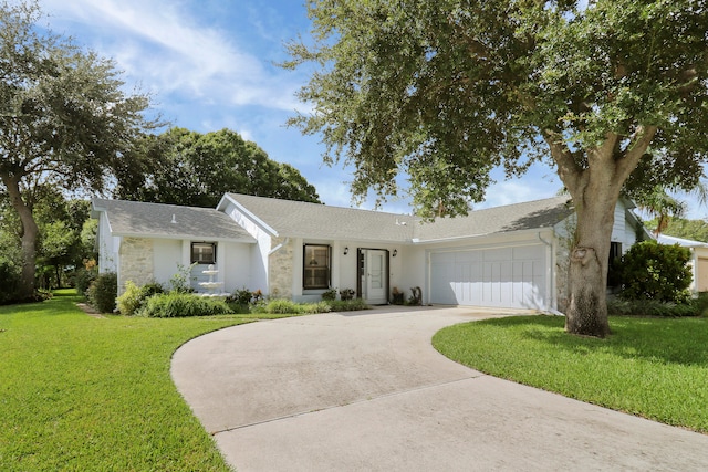 single story home featuring a front yard and a garage