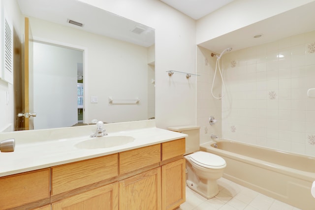 full bathroom with vanity, toilet, tile patterned flooring, and tiled shower / bath