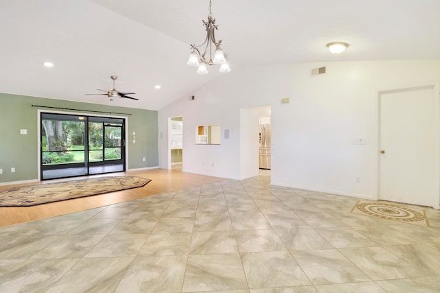 unfurnished living room featuring lofted ceiling, ceiling fan with notable chandelier, and light wood-type flooring