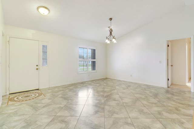 interior space featuring light tile patterned flooring and an inviting chandelier