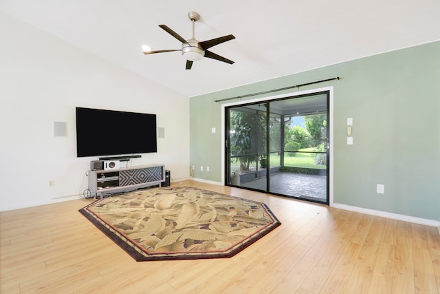 living room with vaulted ceiling, light hardwood / wood-style flooring, and ceiling fan