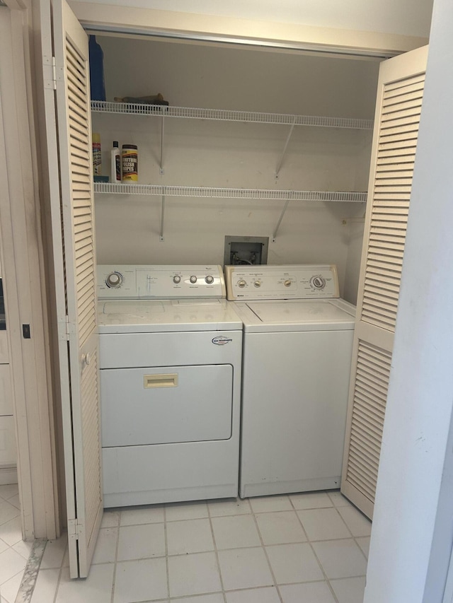 11370 Twelve Oaks Way Unit 117, North Palm Beach, FL 33408 - washroom with washer and dryer and laundry area