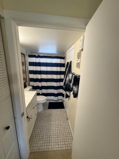 bathroom featuring vanity, a shower with curtain, and toilet