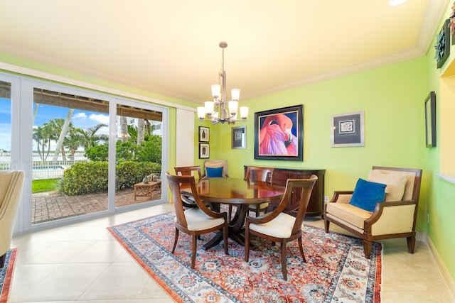 dining area with crown molding, light tile patterned floors, and a chandelier