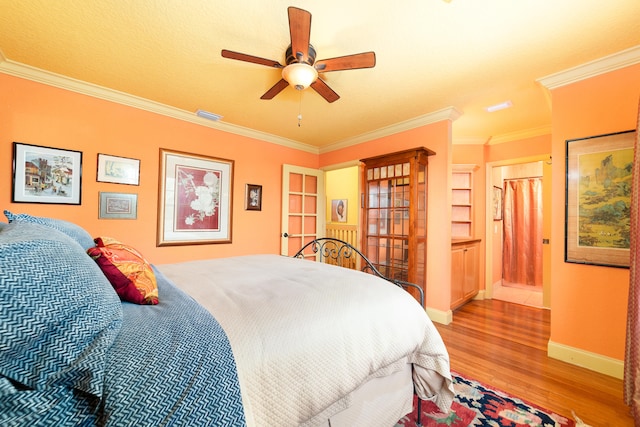 bedroom featuring ornamental molding, hardwood / wood-style floors, a textured ceiling, and ceiling fan