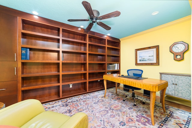 office space with crown molding, a textured ceiling, and ceiling fan