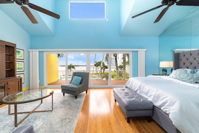 bedroom with access to exterior, high vaulted ceiling, light wood-type flooring, and ceiling fan