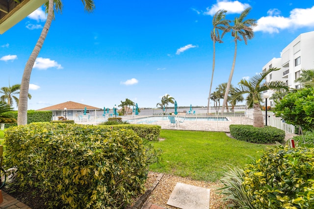 view of yard with a community pool