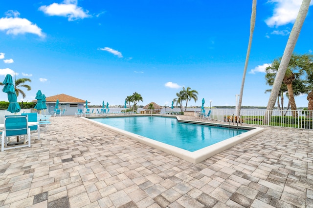 view of swimming pool with a patio