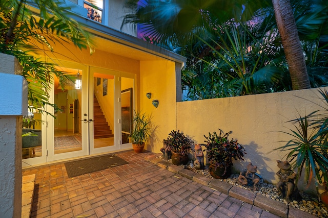 entrance to property with french doors and a patio