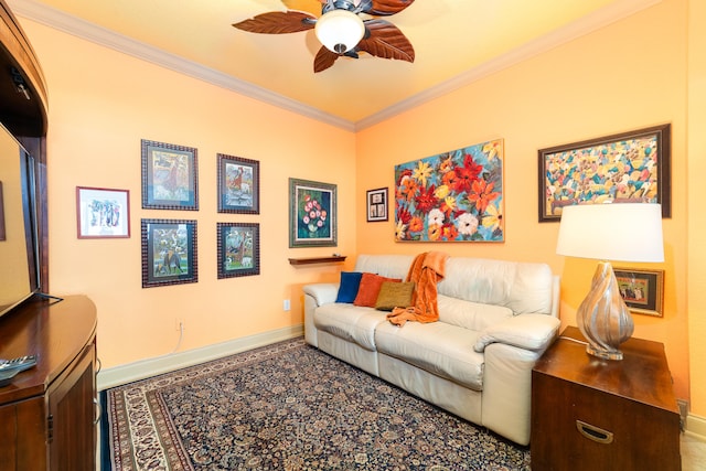 living room with ornamental molding and ceiling fan