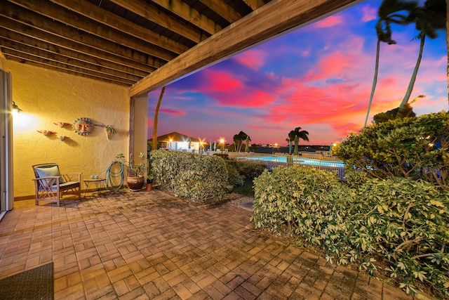 view of patio terrace at dusk