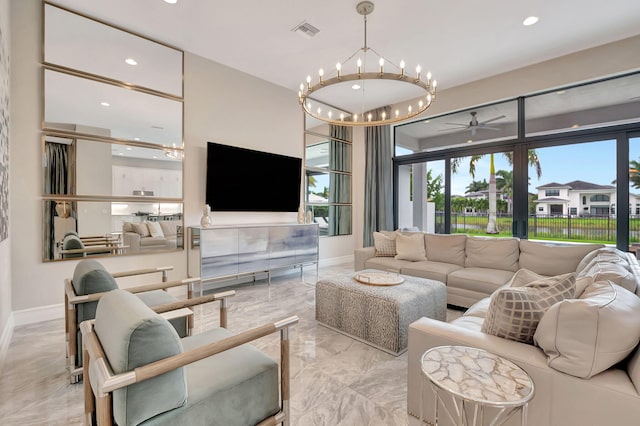 living room with ceiling fan with notable chandelier