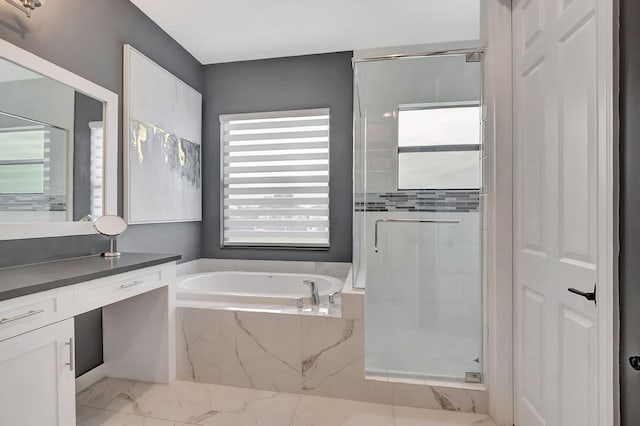 bathroom with vanity, separate shower and tub, and plenty of natural light