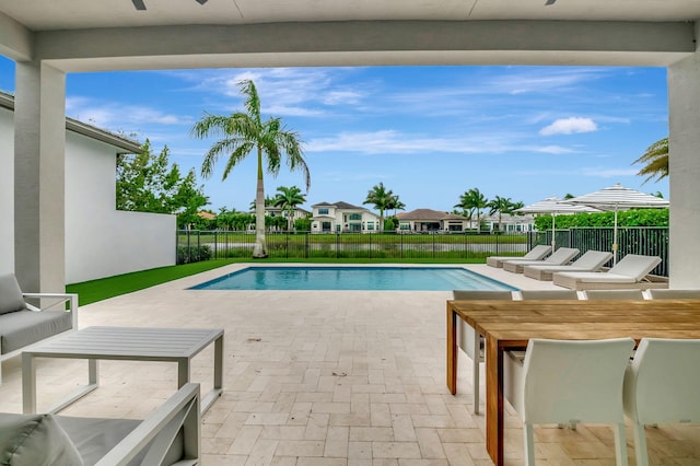 view of swimming pool with a patio area