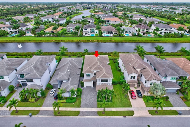 birds eye view of property featuring a water view