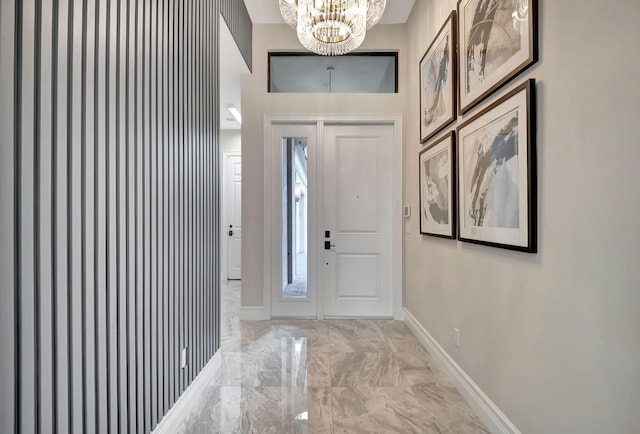 foyer with a notable chandelier