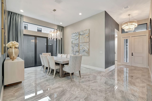 dining space with a notable chandelier