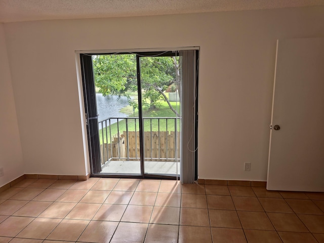 unfurnished room featuring light tile patterned floors
