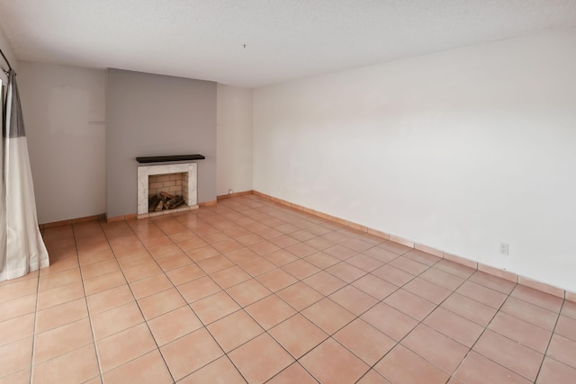 unfurnished living room with light tile patterned floors