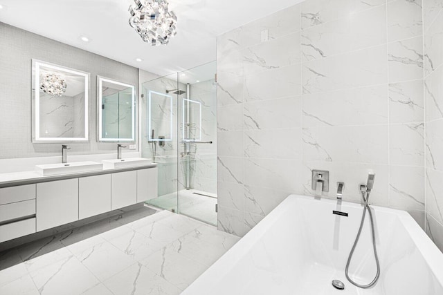 bathroom featuring vanity, tile walls, and plus walk in shower